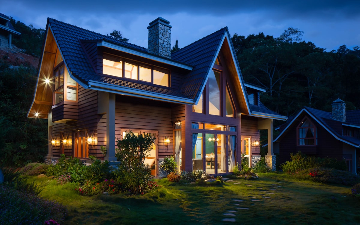 Two-story home with clean rooflines at dusk